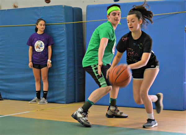 Stetson Hoops for Heart players battle for control of the ball 